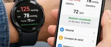 Galaxy Watch en la muñeca midiendo la presión arterial con la pantalla mostrando los resultados. Persona utilizando un smartphone Samsung Galaxy con la aplicación Samsung Health Monitor abierta.